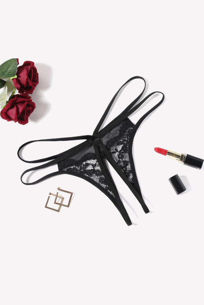 Black floral lace G-string panty with open design, sexy lingerie, red lipstick and roses.