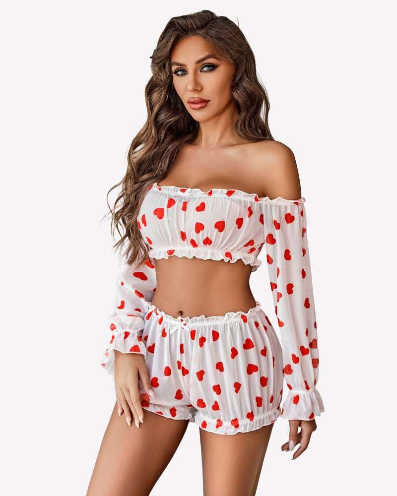 White off-shoulder lingerie set with red heart print, long sleeves, and ruffle trim