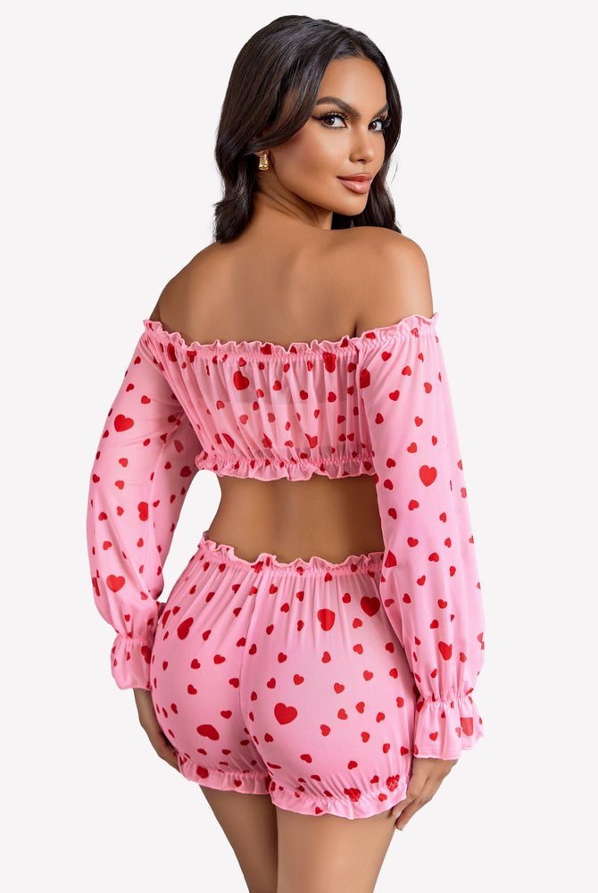 Pink heart-print off-shoulder lingerie set with ruffle details for a confident, sexy style.