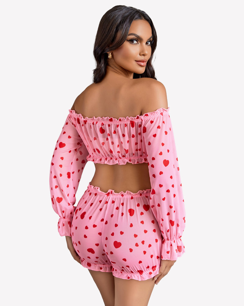 Pink heart-print off-shoulder lingerie set with ruffle details for a confident, sexy style.