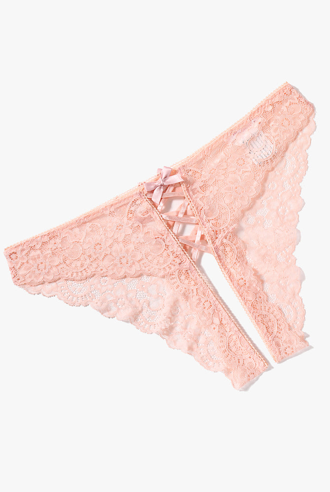 Peach lace hipster panty with criss-cross straps and bow detail. Delicate floral lace design.