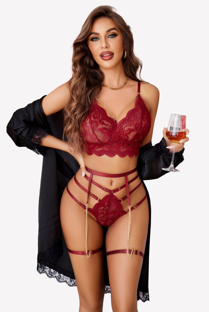 Burgundy lace lingerie set with chain details. Sexy bra, panty, and garter belt.