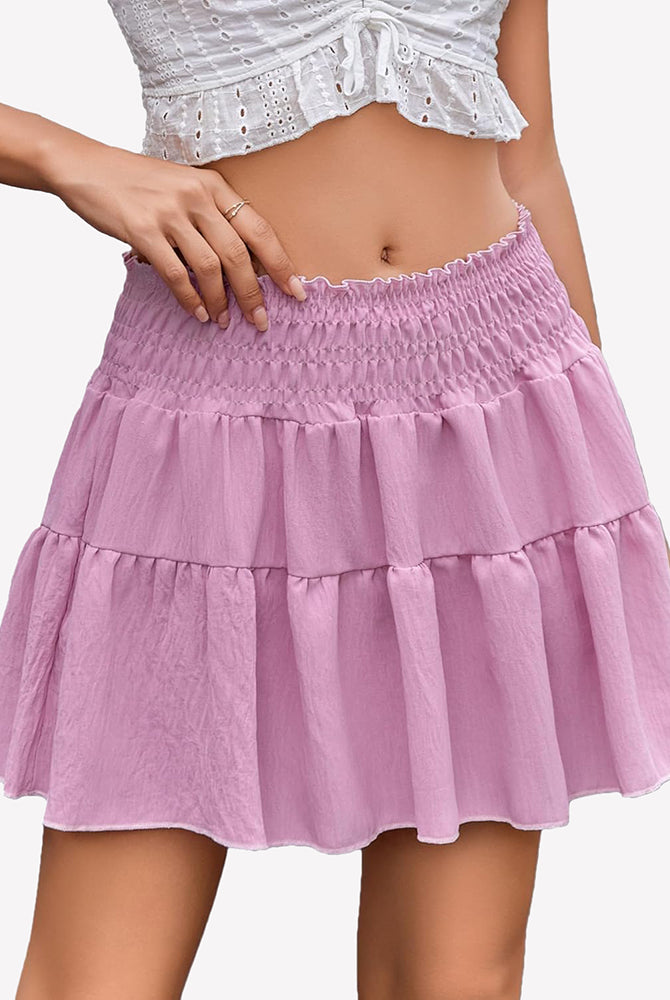 Pink flowy A-line short skirt with tiered ruffles and elastic smocked waistband