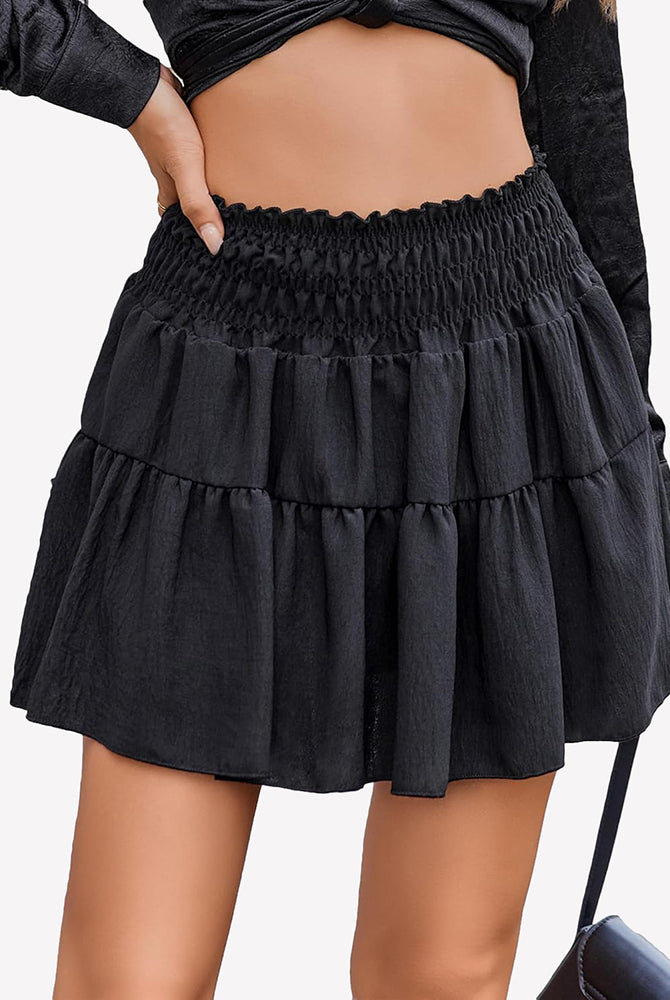Black flowy A-line short skirt with tiered ruffles and elastic smocked waistband