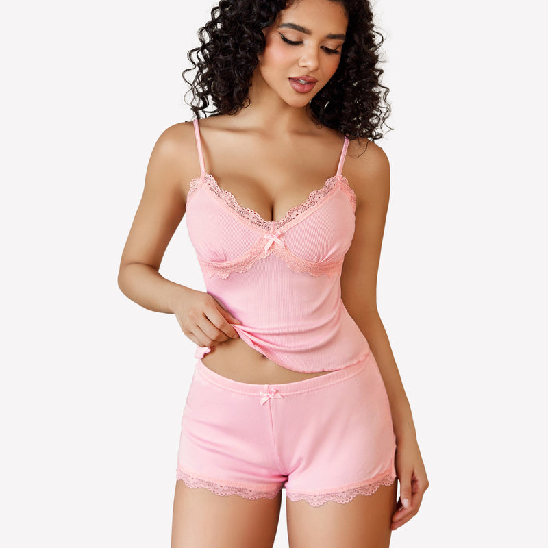 Pink cami pajama set with lace trim, soft and comfortable, perfect for a relaxing night.