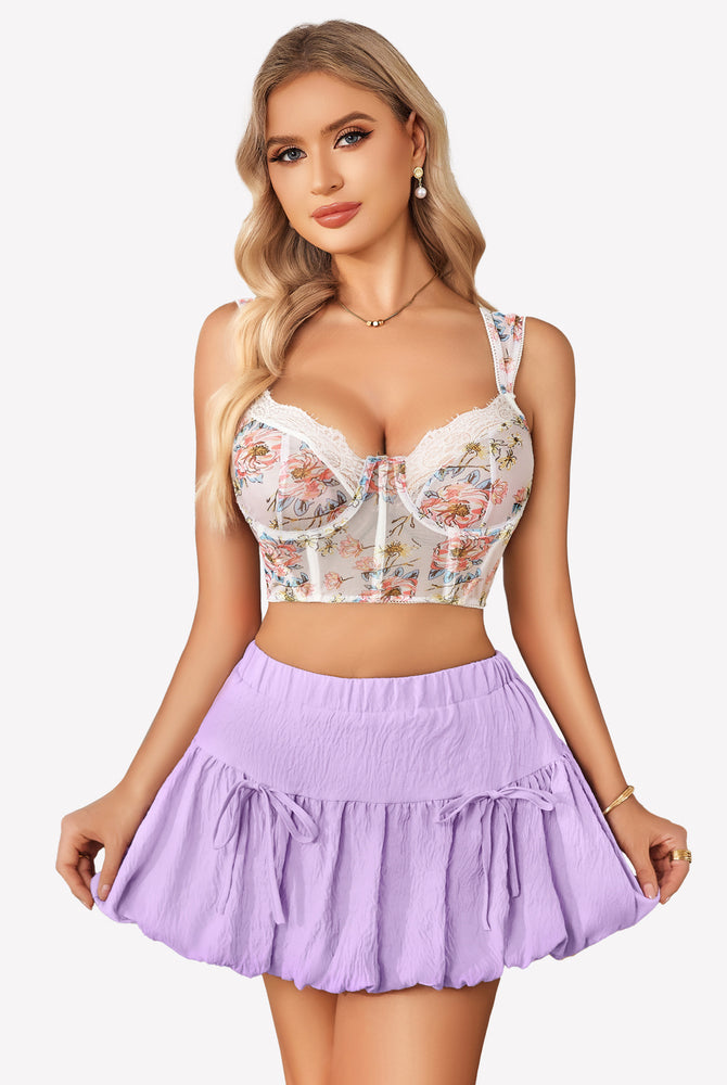 Lavender bubble hem mini skirt with tie details, paired with floral bustier top, Y2K style