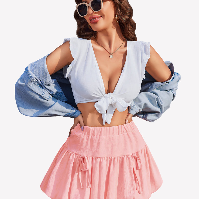 Pink bubble hem mini skirt with tie details, white crop top, Y2K style, perfect for parties