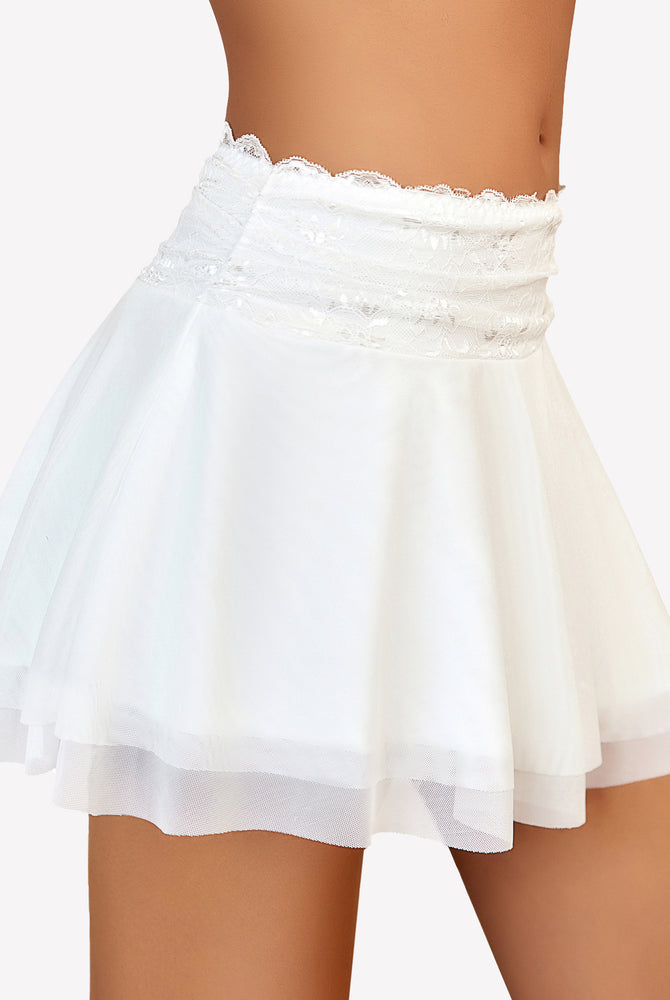White pleated skirt with lace panel and ruffle hem, A-line flared silhouette, ballet style