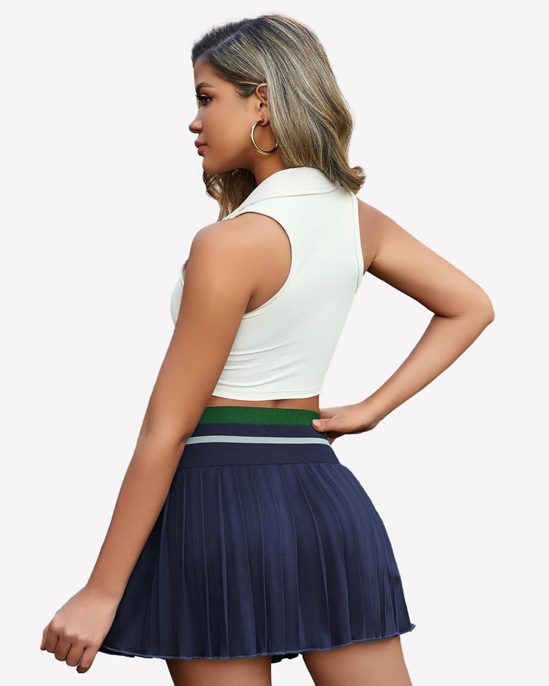 Y2k navy blue pleated mini skirt with white crop top. High-waisted design for confident style.