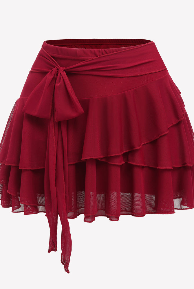 Red ruffle mini skirt with flowy hem, multi-layer design, and waist belt detail