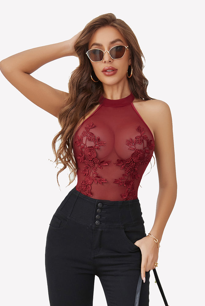 Burgundy mesh embroidered bodysuit with halter neck and floral lace, enhancing confidence.
