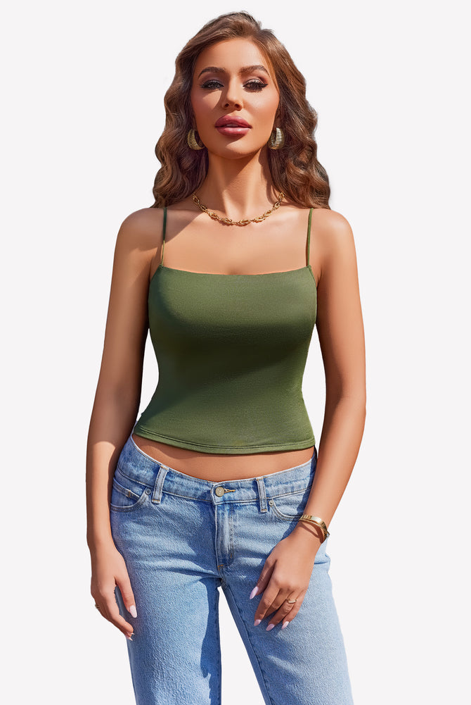 Olive green cropped top with thin straps and light blue jeans, perfect for summer.