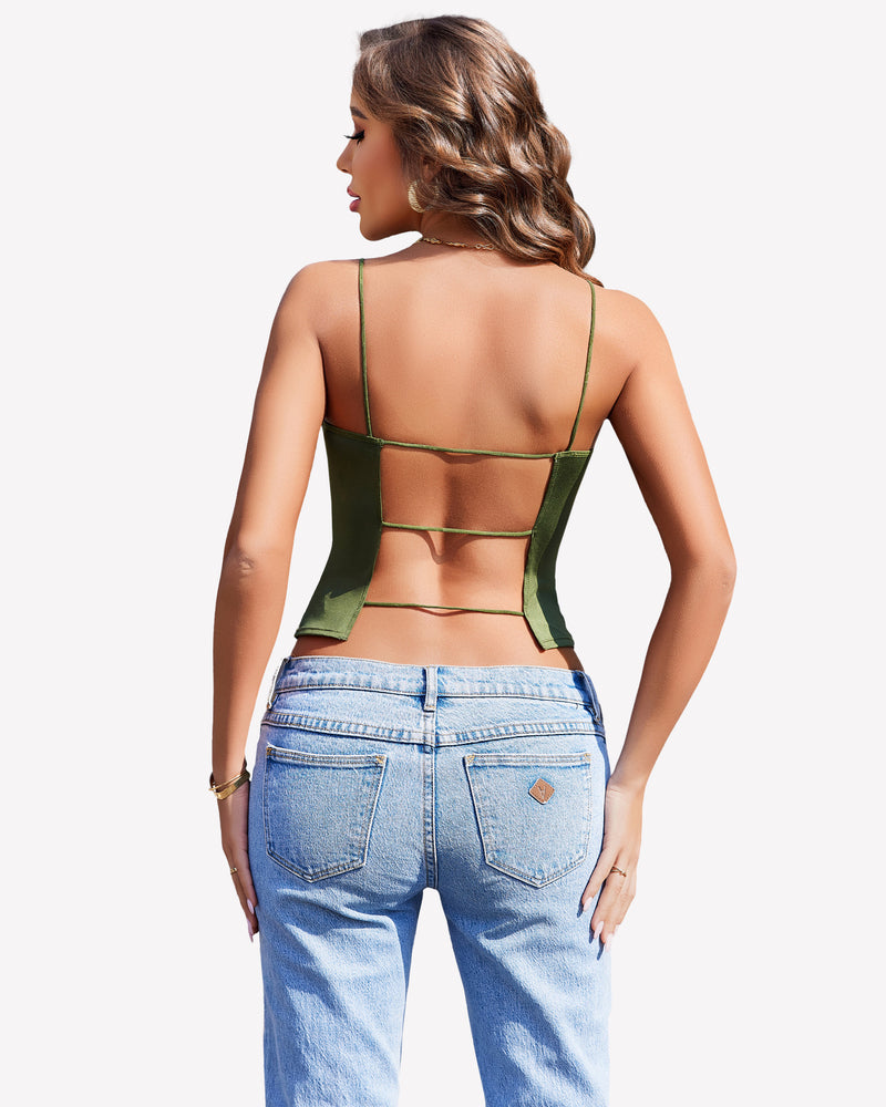 Green backless cropped top with thin straps and light blue jeans, perfect for summer.