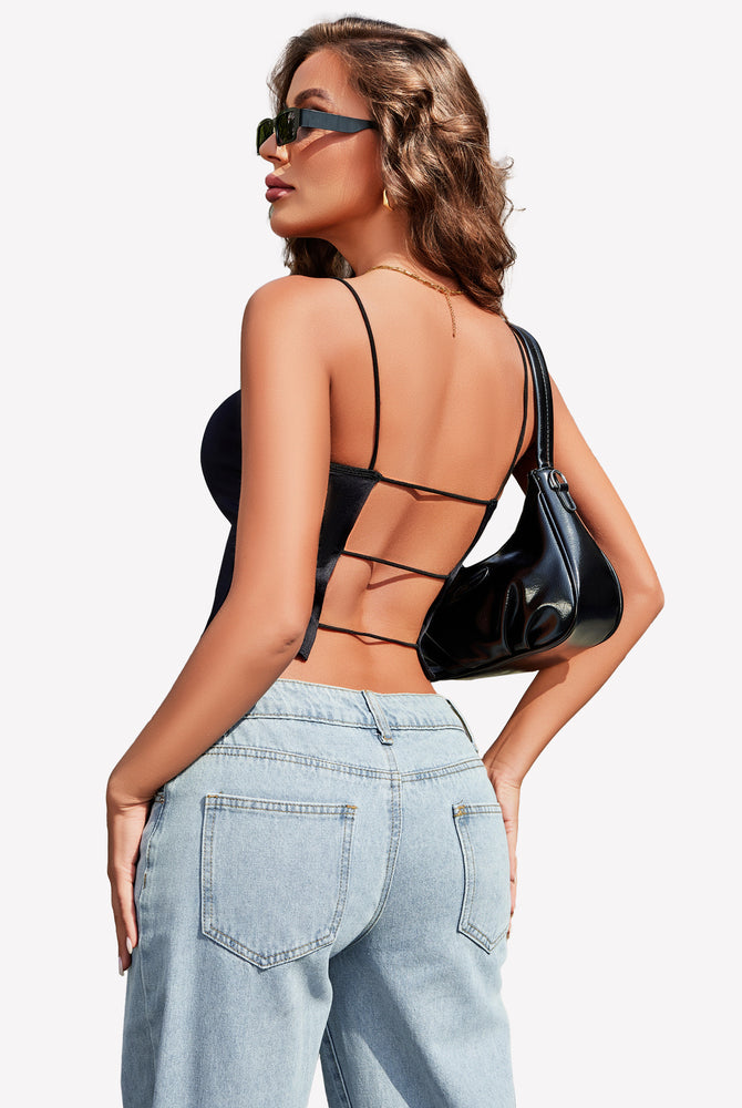 Black backless cropped top with thin straps, paired with light blue jeans, perfect for summer.