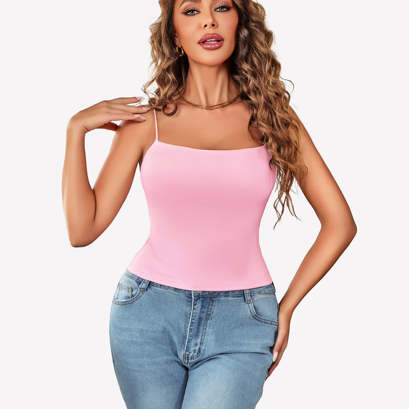 Pink double-lined cropped top with thin straps and light blue jeans, perfect for summer