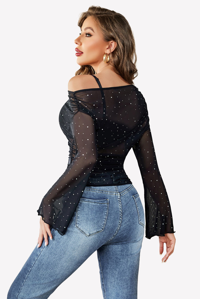 Black mesh off-shoulder shirt with rhinestone accents and bell sleeves, stylish look.