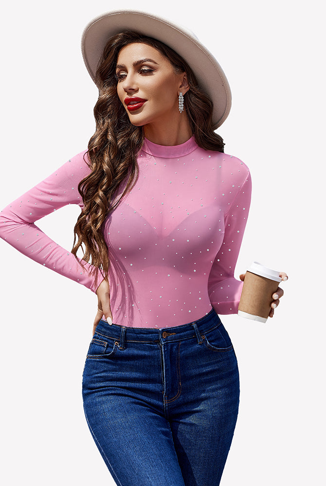 Pink mesh rhinestone sheer top with long sleeves, round neck, and blue jeans - perfect party outfit