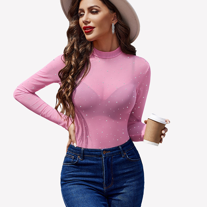 Pink mesh rhinestone sheer top with long sleeves, round neck, and blue jeans - perfect party outfit