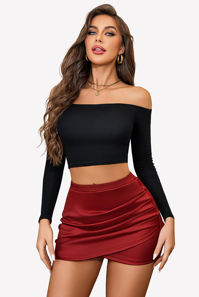 Burgundy ruched mini skirt and black crop top. Y2K party outfit. High-waisted, flattering fit.