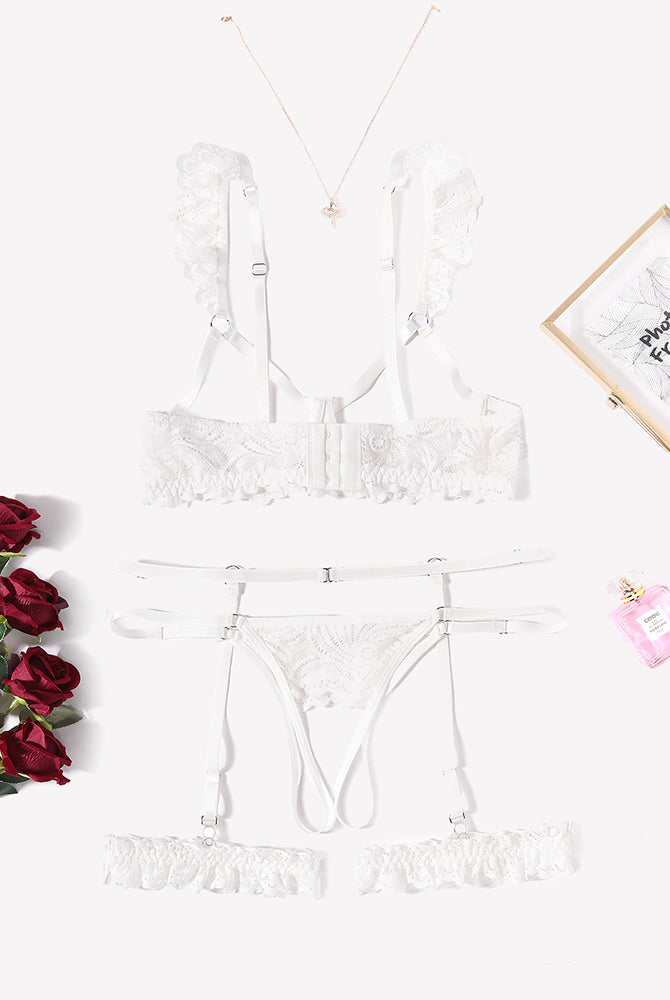 White floral lace lingerie set with garter belt, bra, and panty, perfect for a romantic night.