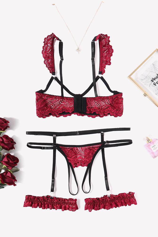 Red floral lace lingerie set with garter belt, bra, thong, and leg rings. Romantic nightwear.
