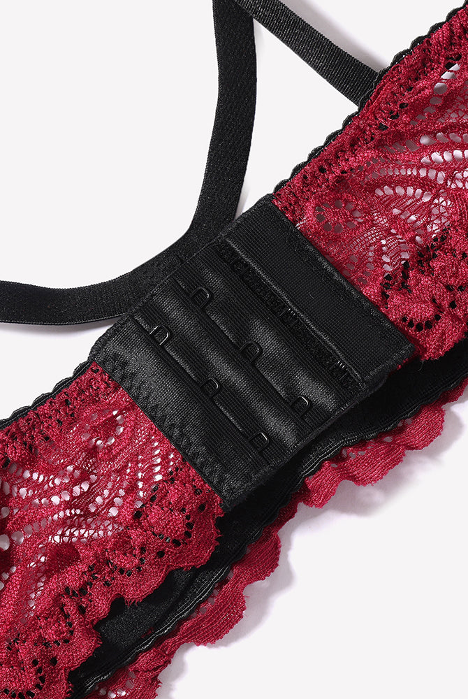 Red floral lace bra with black straps and hook-and-eye closure. Sexy lingerie for women.
