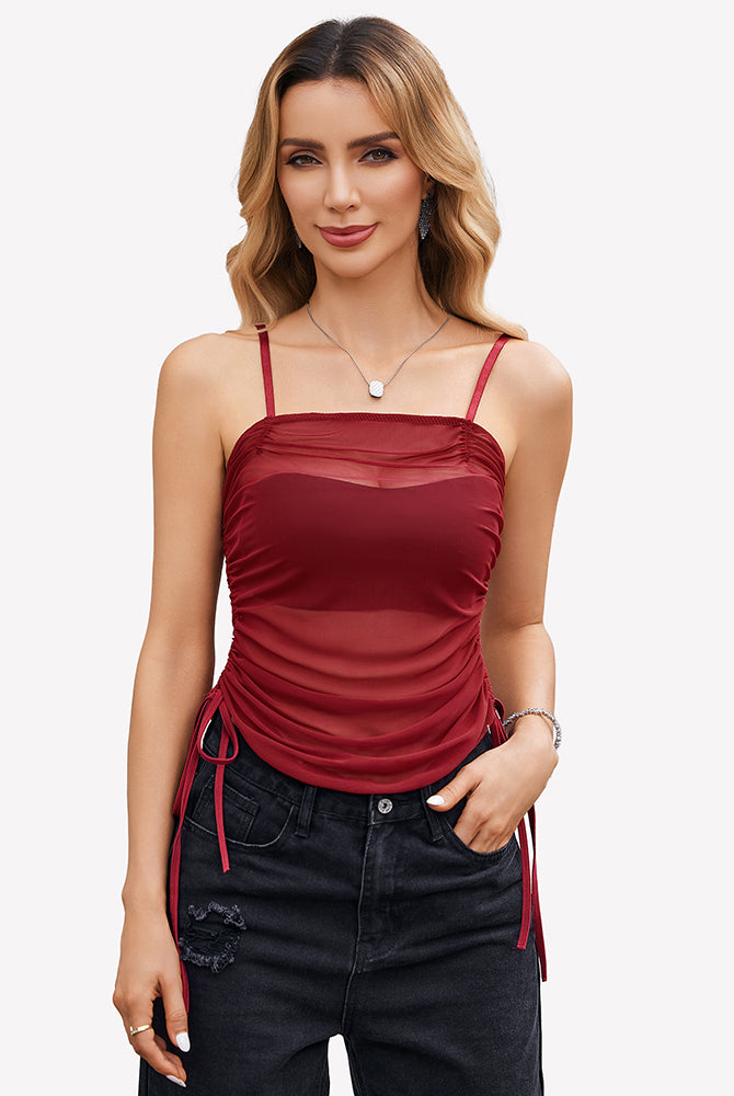 Burgundy mesh camisole top with adjustable spaghetti straps and ruched design.