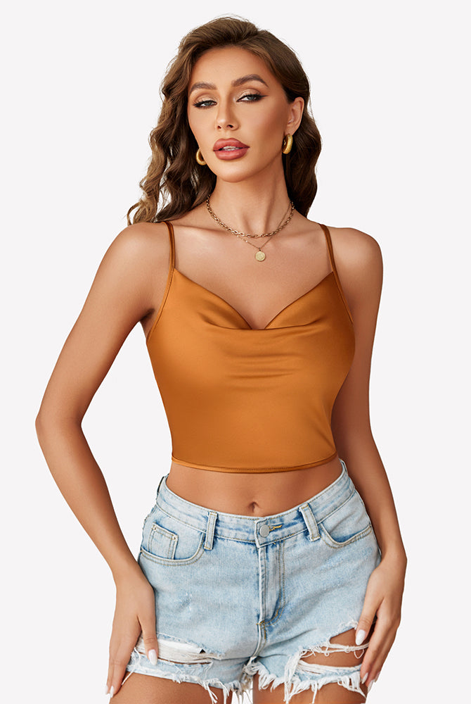Burnt orange silk satin camisole Y2k tank top with spaghetti straps and denim shorts. Modern.