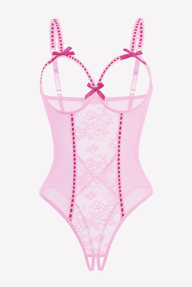 Crotchless lace mini teddy bodysuit in pink with sheer mesh and lace-up straps