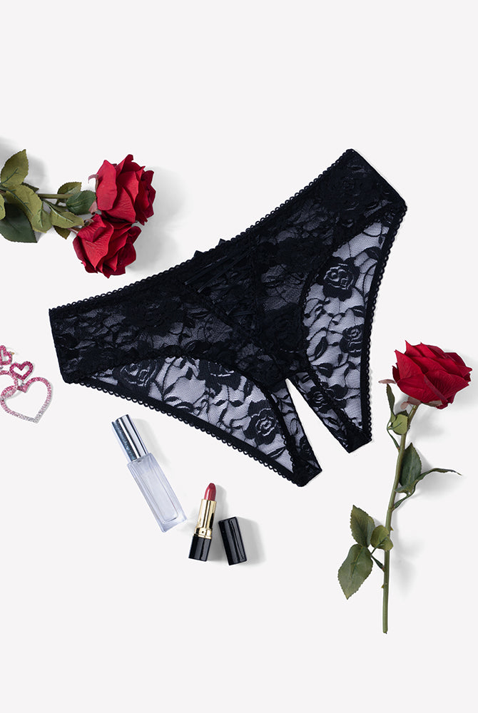 Black floral lace boyshort panties with hollow-out center and bow at waistband.