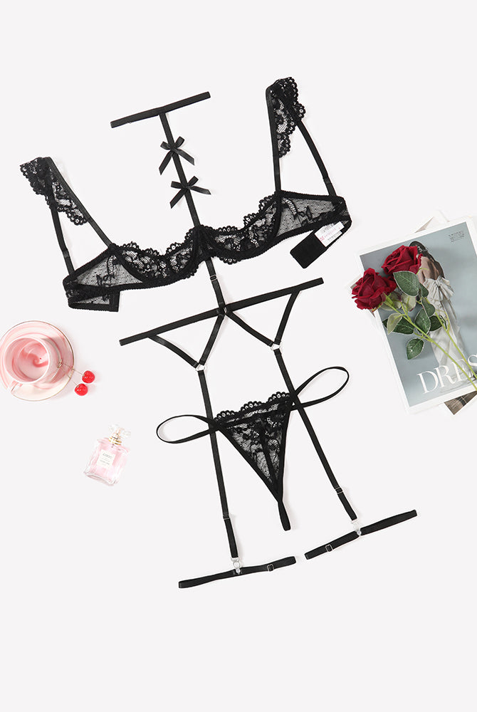 Black lace lingerie set with lace bra, garter belt, choker, and thong panties