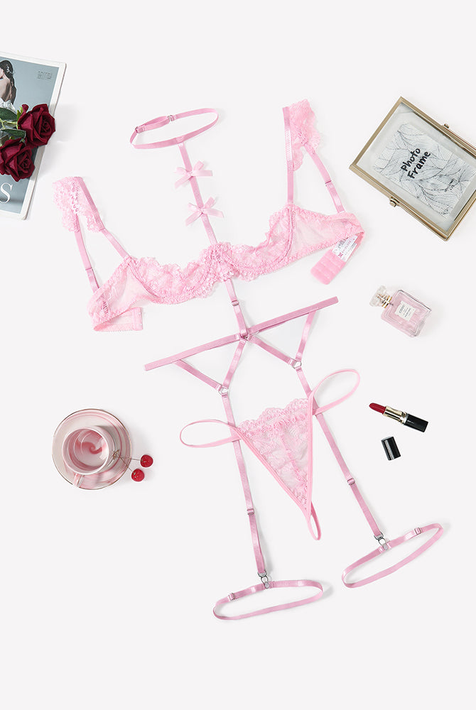Pink lace lingerie set with lace bra, choker, garter belt, and thong panties