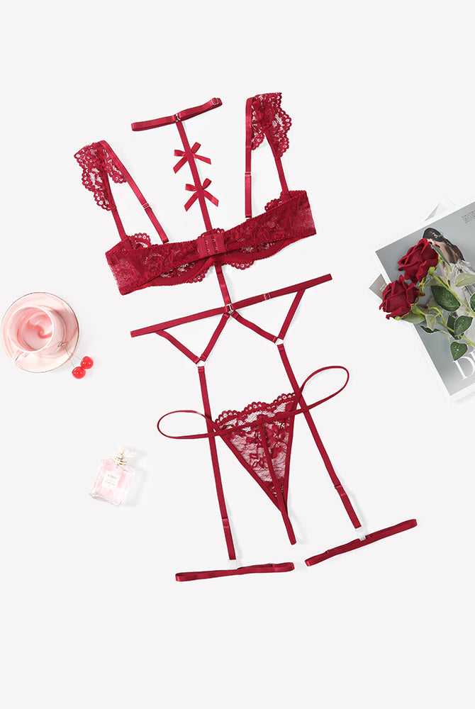 Red lace lingerie set with lace bra, garter belt, choker, and thong panties