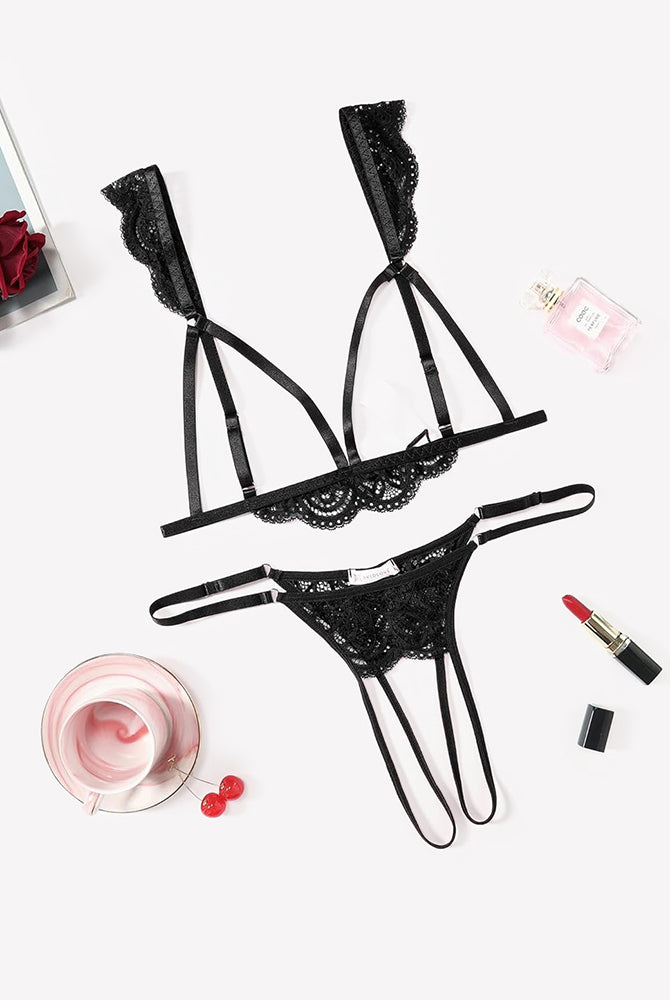 Black lace triangle bra with adjustable straps and matching thong, cutout sides