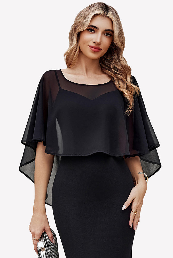 Black chiffon cape shawl with flowing cape sleeves, angled view over dress