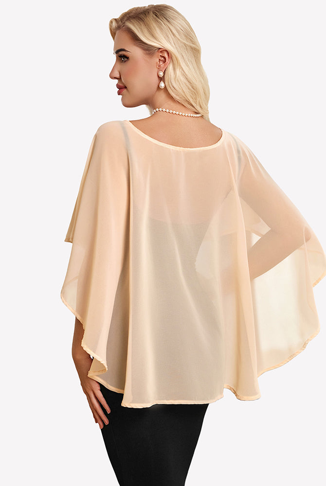 Champagne chiffon cape shawl with draped flutter sleeves and a rounded neckline.
