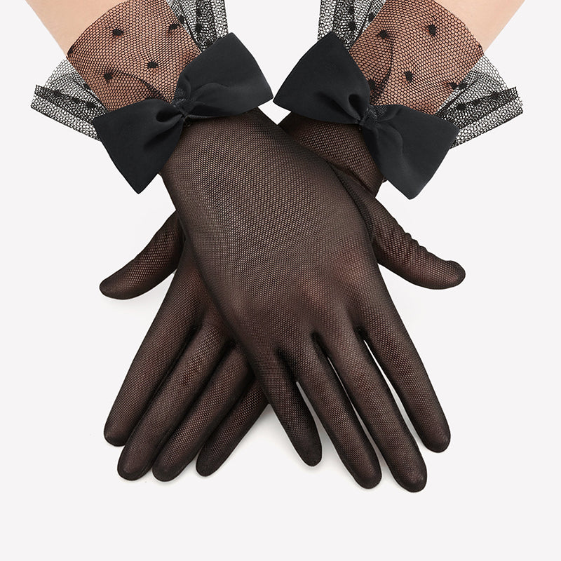 Black mesh short gloves with polka-dot accents and oversized bow ties at wrist