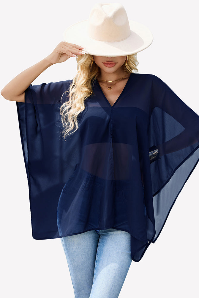 Dark navy off-shoulder chiffon blouse, billowy batwing sleeves with airy drape.