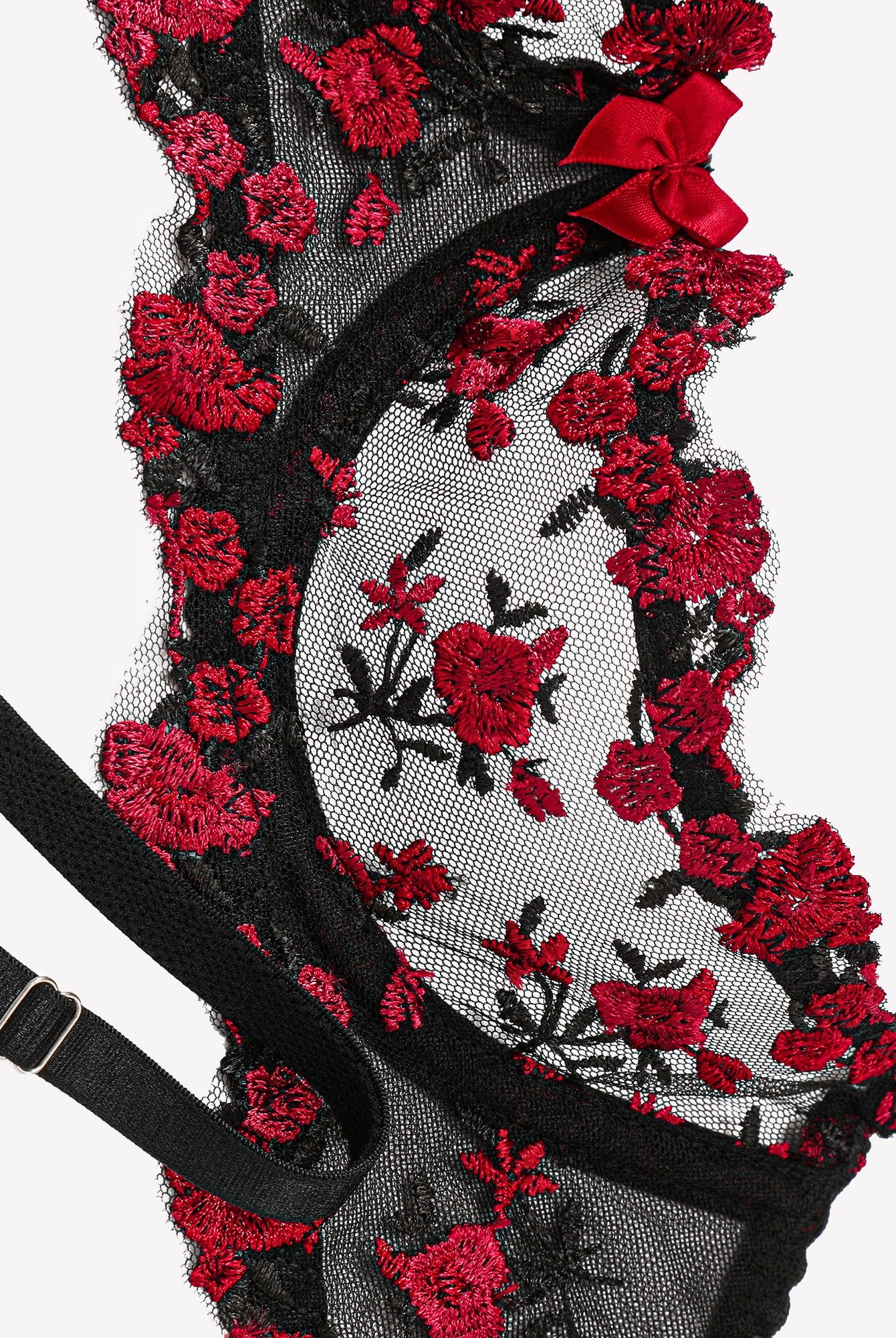 Embroidered sheer panty with black mesh and red floral lace, close-up