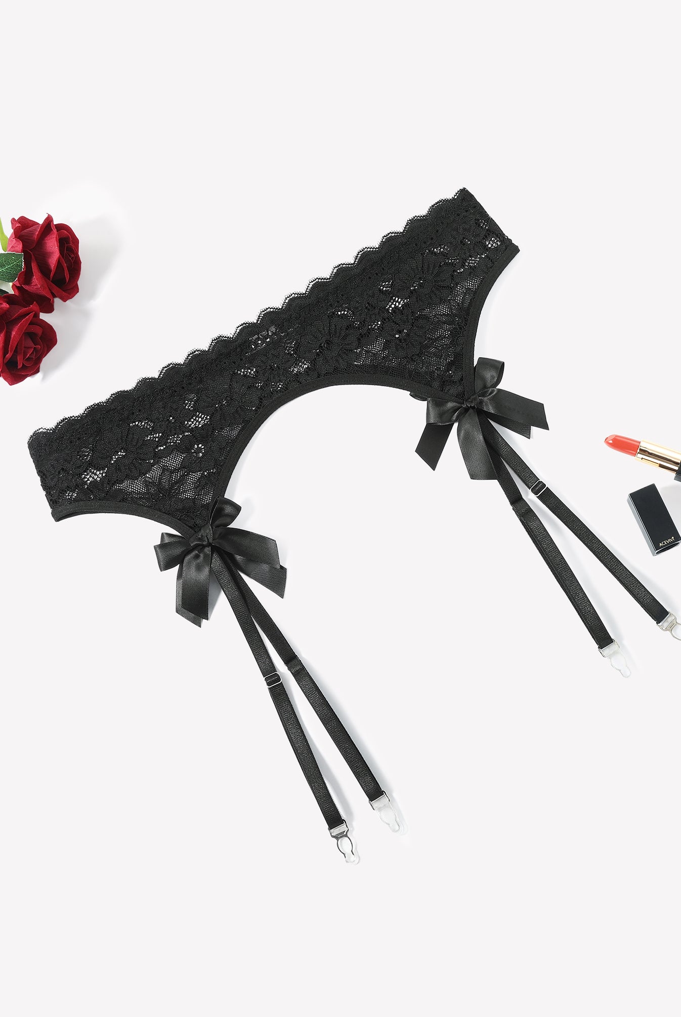 Black lace garter belt with 4 suspender straps and bow accents