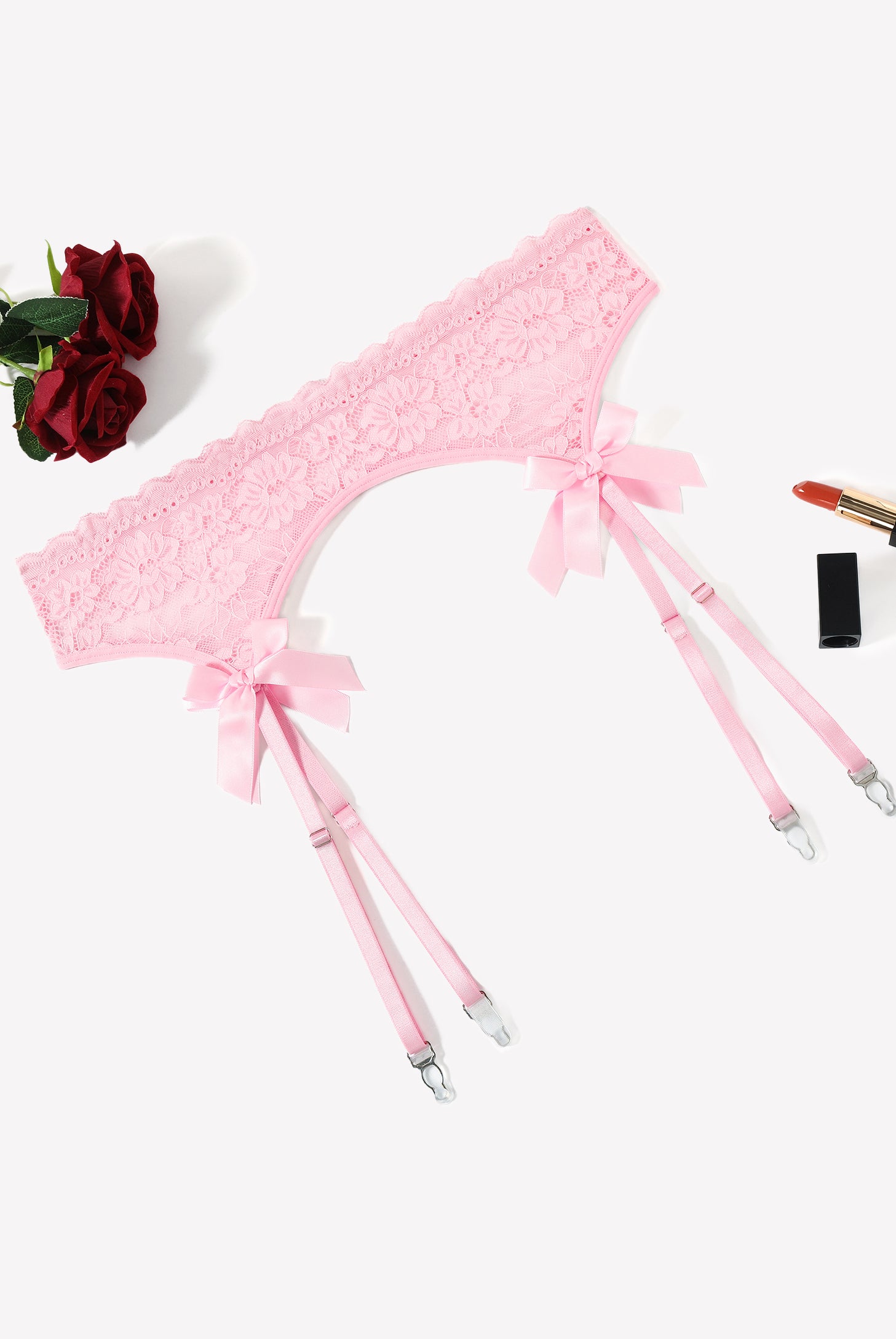 Pink lace garter belt with 4 suspender straps and ribbon bow accents