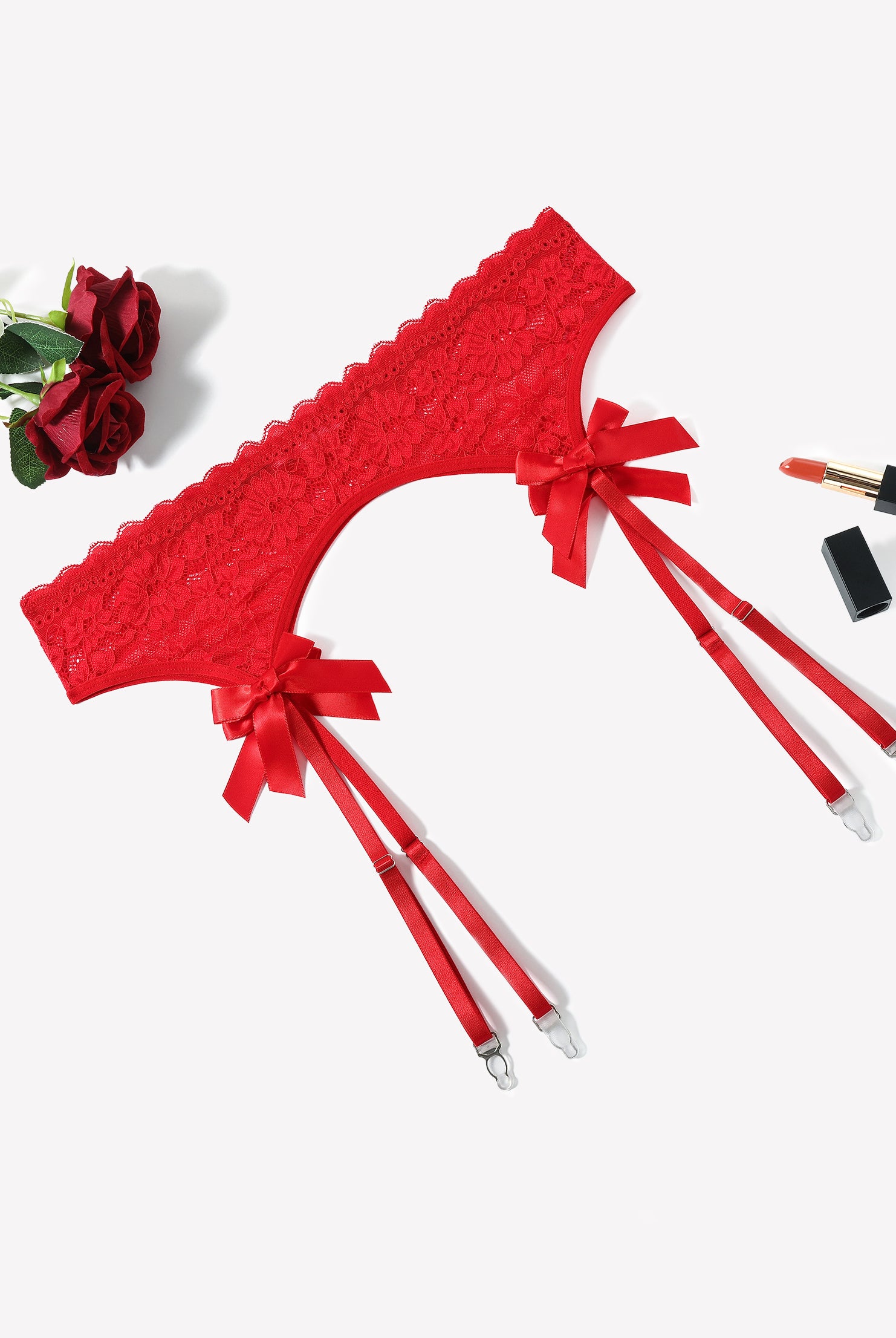 Carmine red lace garter belt with four adjustable suspender straps and bow ties