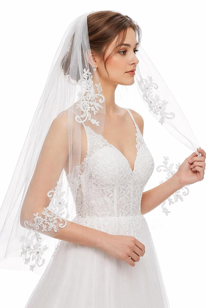 White wedding veil with delicate floral lace edge and sheer shoulder drape