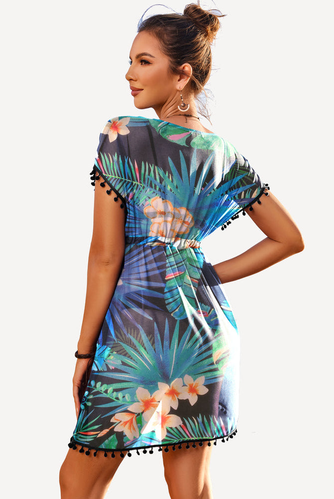 Floral beach cover-up with deep V-neck, tassels and drawstring. Ideal for beachwear.