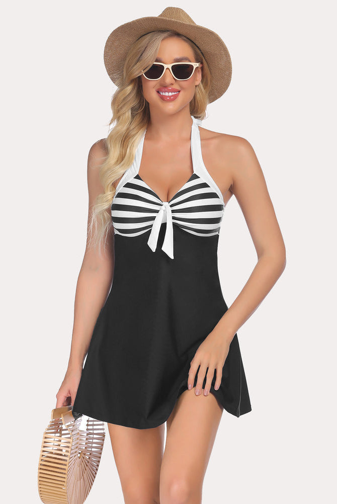 Halter tankini swimdress. Two-piece swimsuit with black and white stripes and skirted bottom.