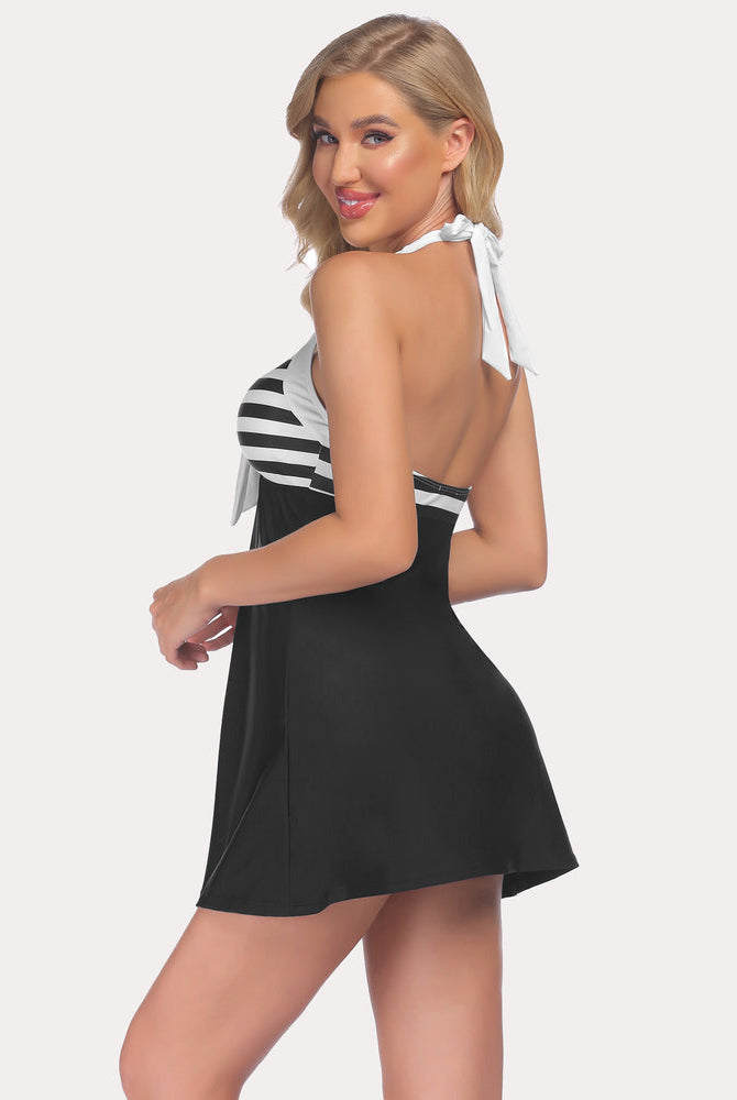 Halter swimsuit with striped top and skirted bottom, perfect for a summer beach look.