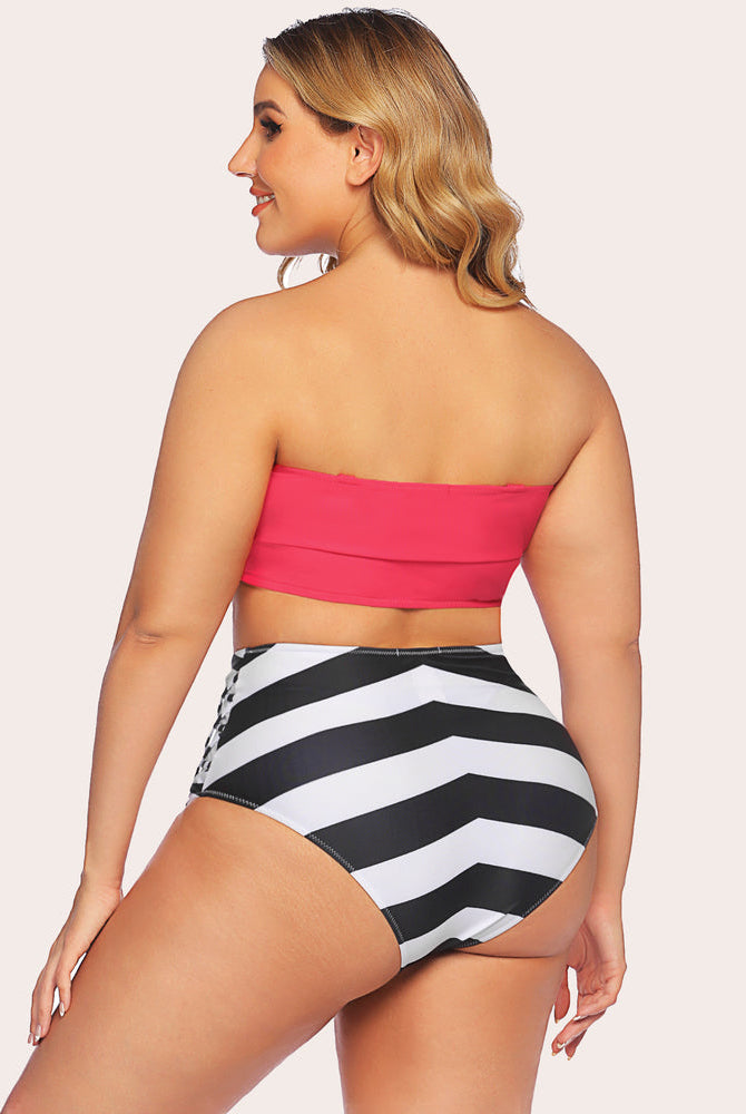 Plus size tummy control swimwear: red bandeau top, chevron high-waisted bottom, beach ready.
