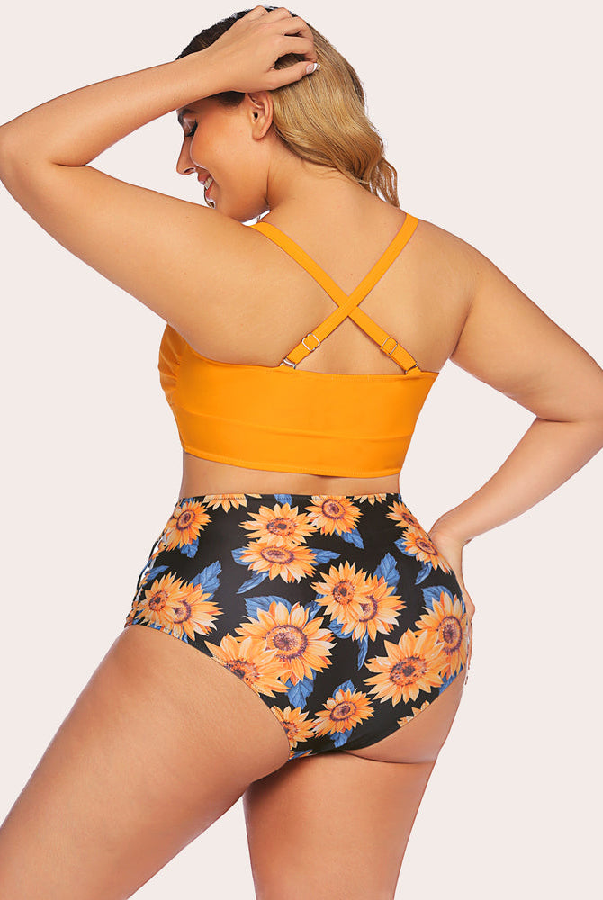 Plus size high-waisted bikini: orange top, sunflower print bottom, tummy control swimwear