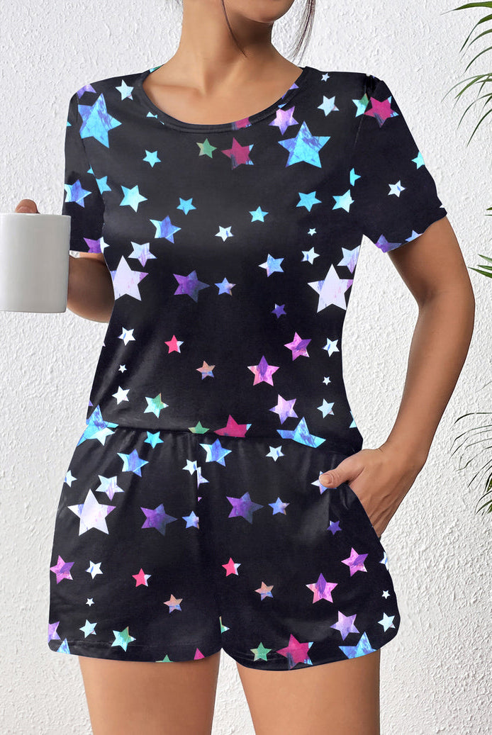 Black short-sleeve pajama set with colorful star print; matching shorts