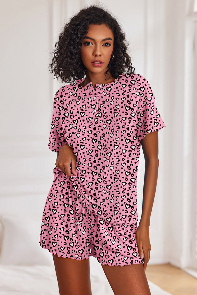 Women's pink leopard-print short-sleeve pajama set with button top and drawstring shorts